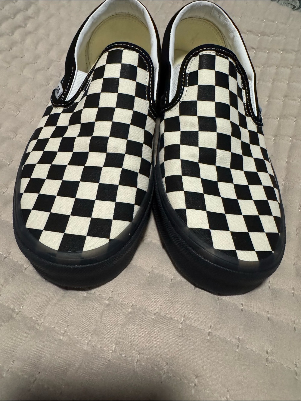 Vans Black and White Checkerboard Slip-On Sneakers
